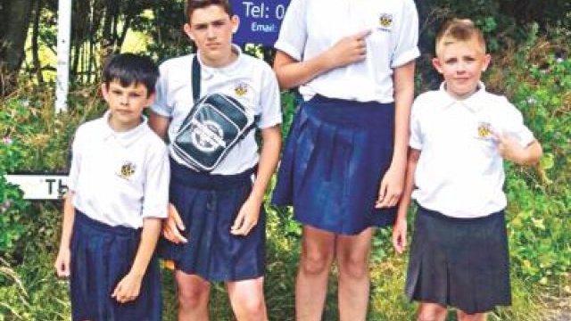 Schoolboys wear skirts in protest - Dainikshiksha